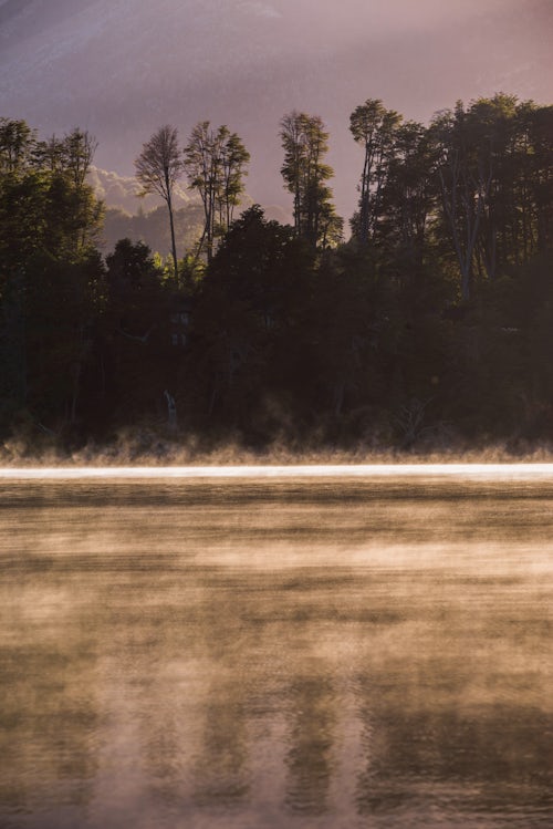 Argentina Travel Landscape Photography Misty forest at sunrise at Nahuel Huapi Lake Villa la Angostura Neuquen Patagonia Argentina South America background with copy space