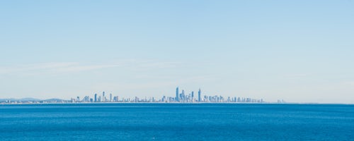 Australia Travel Photography View Across the Ocean to the City Skyline of Surfers Paradise from Coolangatta Beach Gold Coast Australia background with copy space