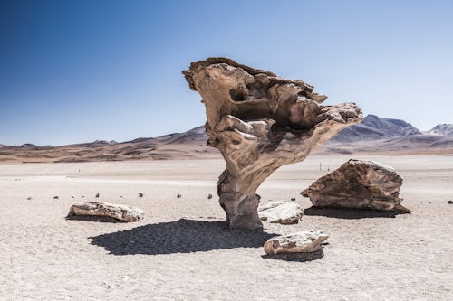 Bolivia Travel Landscape Photography Arbol de Piedra stone tree a lava cooled rock formation in the Siloli Desert part of Atacama Desert in the Altiplano of Bolivia South America