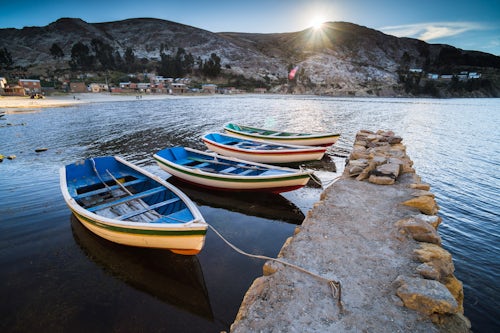 Bolivia Travel Landscape Photography Boats in the harbour on Lake Titicaca at Challapampa village Isla del Sol Island of the Sun Bolivia South America