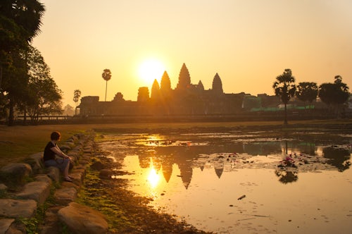 Cambodia Travel Photography Tourist Sat Watching Sunrise at Angkor Wat Cambodia Southeast Asia