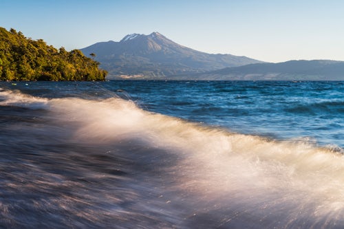 Chile Travel Landscape Photography Calbuco Volcano at sunset seen from a beach on Llanquihue Lake Chilean Lake District Chile South America