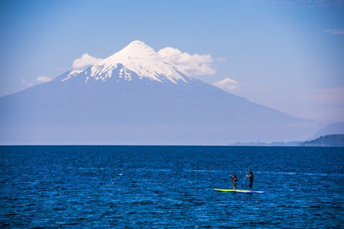 Chile Travel Landscape Photography Paddleboarding on Llanquihue Lake with Osorno Volcano Volcan Osorno behind Puerto Varas Chile Lake District South America