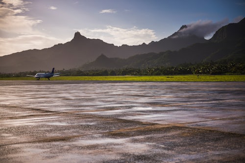 Cook Islands Landscape Travel Photography Airplane on the runway at the airport on the tropical island of Rarotonga at sunrise Cook Islands