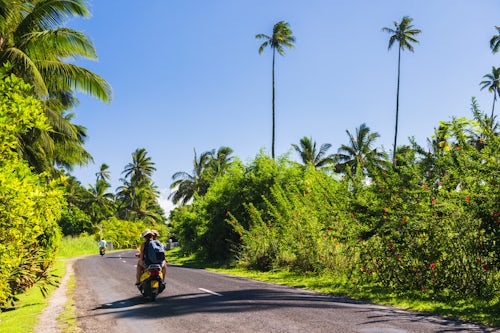 Cook Islands Landscape Travel Photography Moped driving on the circular road around Rarotonga Cook Islands