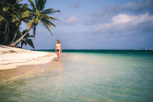 Cook Islands Landscape Travel Photography Woman walking along a tropical baech Rarotonga Island Cook Islands