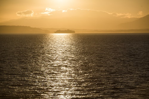 Costa Rica Travel Landscape Photography Car and passenger ferry crossing Gulf of Nicoya at sunrise to Punta Arenas Costa Rica Central America