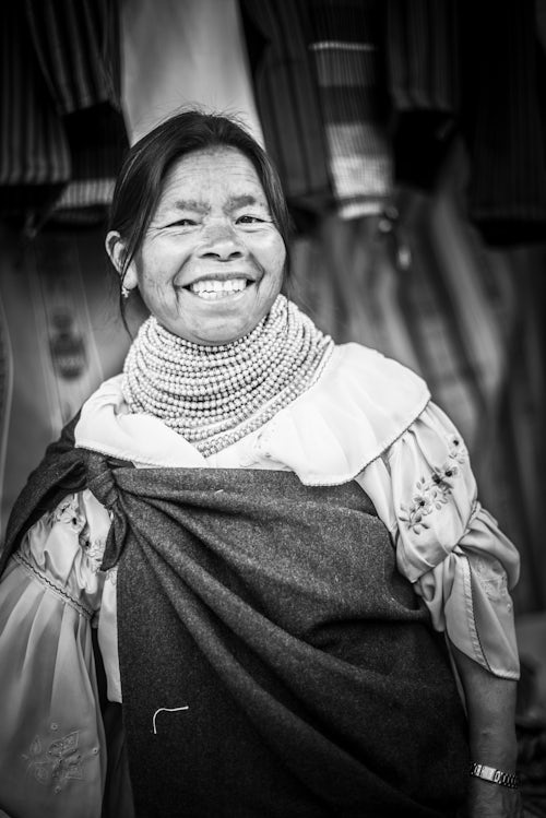 Ecuador Travel Photography Portrait of a market stall owner in Otavalo Market Imbabura Province Ecuador