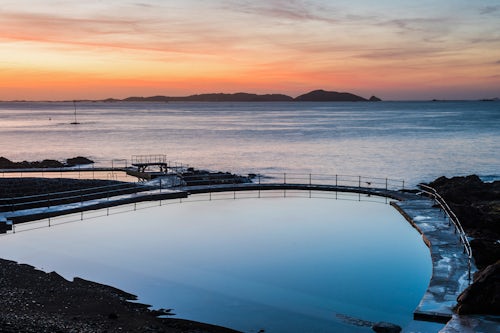 Guernsey Channel Islands Landscape Photography Guernsey Bathing Pools at sunrise with Herm Island behind Channel Islands United Kingdom