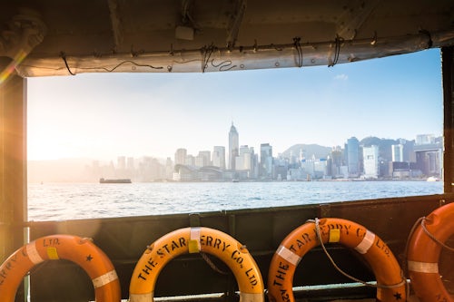 Hong Kong Travel Photography Star Ferry at sunrise with Hong Kong Island behind Hong Kong China