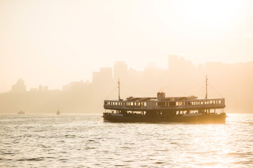 Hong Kong Travel Photography Star Ferry at sunset between Hong Kong Island and Kowloon Hong Kong China