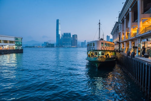Hong Kong Travel Photography Star Ferry leaving Hong Kong Island towards Kowloon at night Hong Kong China