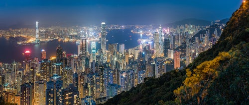 Hong Kong Travel Photography View over Hong Kong Island Victoria Harbour and Kowloon at night seen from Victoria Peak China