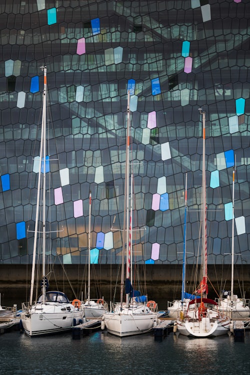 Iceland Travel Photography Harpa Concert Hall and Conference Centre and boats in Reykjavik Harbour Iceland Europe
