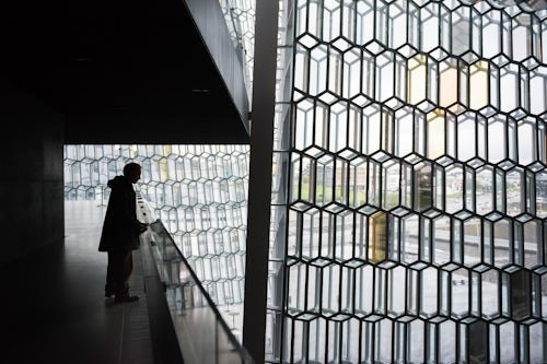 Iceland Travel Photography Tourist at Harpa Concert Hall and Conference Centre Reykjavik Iceland