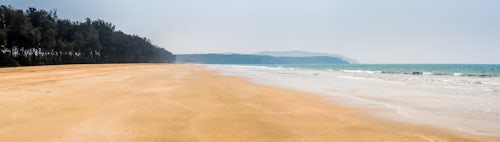 India Landscape Photography White sandy Galgibag Beach with golden sand and blue sky South Goa India