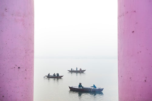 India Travel Photography Boats in the mist at dawn on the Ganges River Varanasi Uttar Pradesh India