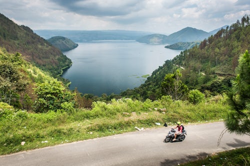 Indonesia Travel Photography Tourist exporing Lake Toba Danau Toba by motorcycle North Sumatra Indonesia Asia
