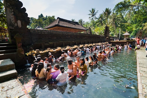 Indonesia Documentary Travel Photography Balinese people in holy spring water in the sacred pool at Pura Tirta Empul Temple Tampaksiring Bali Indonesia Southeast Asia Asia Asia