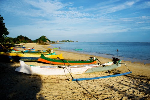 Indonesia Travel Photography Traditional Fishing Boats on Kuta Beach at the Traditional Fishing Village of Kuta Lombok West Nusa Tenggara Indonesia Asia background with copy space