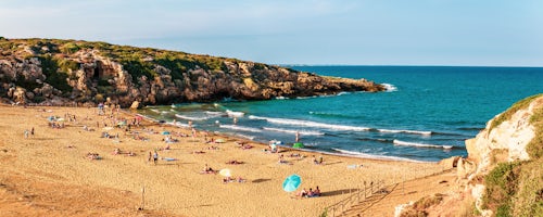 Italy Sicily Travel Photography Calamosche Beach panoramic photo of people sunbathing on the beach near Noto in the Vendicari Nature Reserve South East Sicily Italy Europe