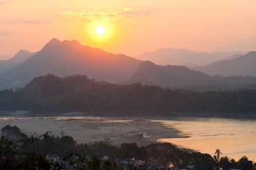 Laos Travel Photography Sunset Over the Mekong River at Wat Phousi Luang Prabang Laos Southeast Asia