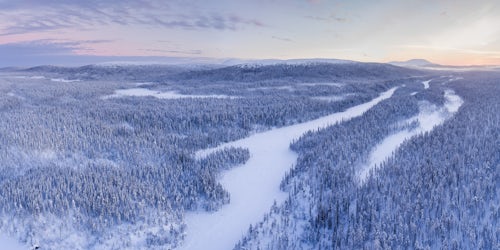 Lapland Finland Drone Landscape Photography Aerial of frozen river and snow covered forest winter landscape showing amazing Lapland scenery in Scandinavia in Finland drone 2