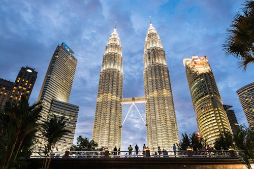 Malaysia Kuala Lumpur Travel Photography Tourists at Petronas Twin Towers at night Kuala Lumpur Malaysia Southeast Asia