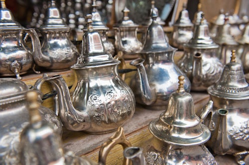 Morocco Travel Photography Traditional metal Moroccan mint tea pots for sale in the Marrakech souks in the old Medina Morocco North Africa Africa