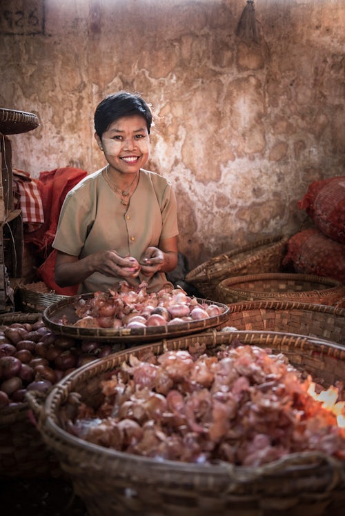 Myanmar Burma Portrait Travel Photography Documentary Portraiture Hsipaw market portrait of a woman peeling onions Shan State Myanmar Burma