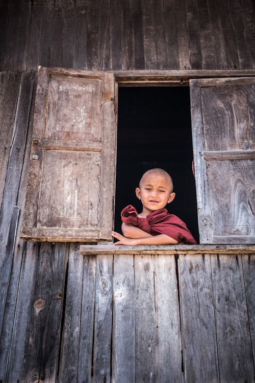 Myanmar Burma Portrait Travel Photography Documentary Portraiture Novice Monk at a Buddhist Monastery between Inle Lake and Kalaw a popular 2 day trek in Shan State Myanmar Burma