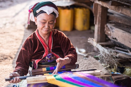 Myanmar Burma Portrait Travel Photography Documentary Portraiture Palaung woman weaving part of the Palau Hill Tribe near Hsipaw Township Shan State Myanmar Burma 2
