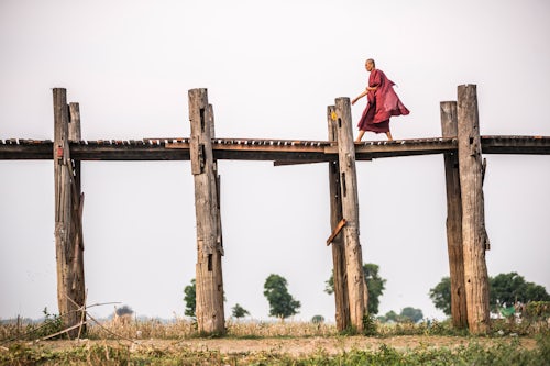 Myanmar Burma Travel Photography Buddhist Monk on U Bein Teak Bridge a 1 2km wooden bridge Mandalay Mandalay Region Myanmar Burma