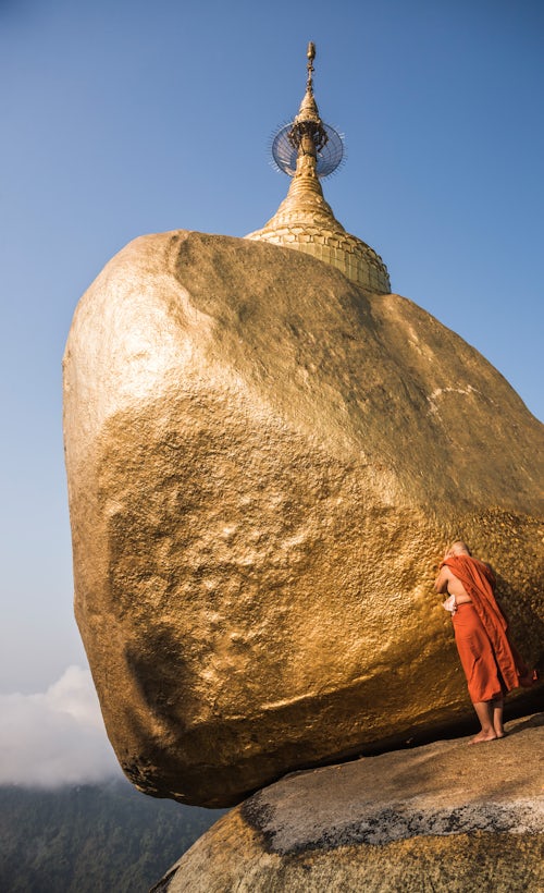 Myanmar Burma Travel Photography Buddhist Monk praying at Golden Rock Kyaiktiyo Pagoda Mon State Myanmar Burma