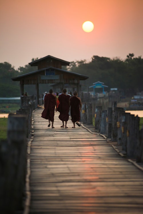 Myanmar Burma Travel Photography Buddhist Monks on U Bein Teak Bridge at sunrise Mandalay Mandalay Region Myanmar Burma