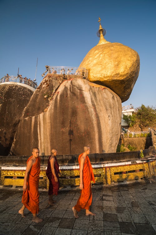 Myanmar Burma Travel Photography Buddhist monks at Golden Rock Stupa Kyaiktiyo Pagoda at sunset Mon State Myanmar Burma