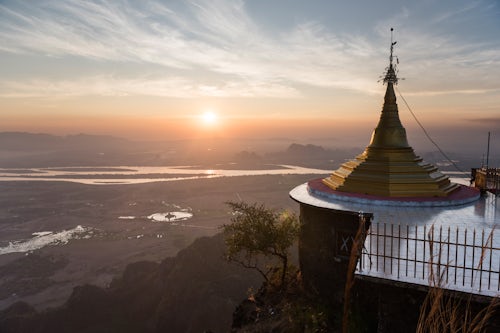 Myanmar Burma Travel Photography Gold stupa at the monastery at the top of Mount Zwegabin at sunset Hpa An Kayin State Karen State Myanmar Burma