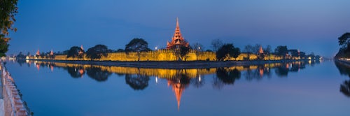 Myanmar Burma Travel Photography Mandalay City Fort and Palace reflected in the moat surrrounding the compound at night Mandalay Myanmar Burma