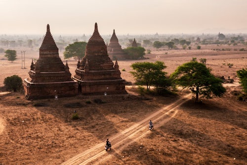 Myanmar Burma Travel Photography Tourists exploring the Temples of Bagan Pagan at sunrise Myanmar Burma