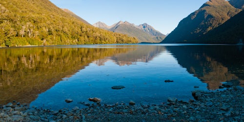 New Zealand Landscape Photography Panoramic Photo of the Reflection of Mountains in Lake Gunn Fiordland South Island New Zealand