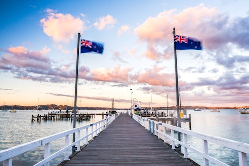 New Zealand Landscape Travel Photography Russell Pier at sunset with New Zealand flag Bay of Islands Northland Region North Island New Zealand