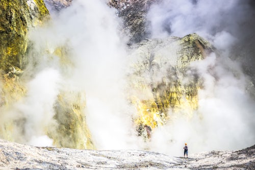 New Zealand Travel Photography Tourist exploring White Island Volcano an active volcano in the Bay of Plenty North Island New Zealand
