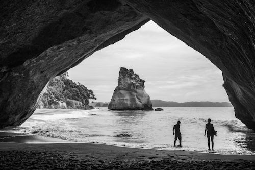 New Zealand Travel Photography Tourists at Cathedral Cove Coromandel Peninsula New Zealand North Island