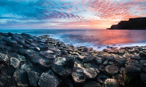 Northern Ireland UK Landscape Photography Giants Causeway and its hexagonal basalt rocks with a dramatic sunrise on the Antrim Coast Northern Ireland