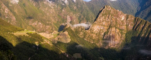 Peru Travel Photography Machu Picchu Inca ruins at sunrise seen from Sun Gate Inti Punku or Intipuncu Cusco Region Peru South America
