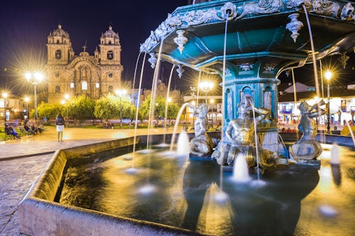 Peru Travel Photography Plaza de Armas Fountain and Church of the Society of Jesus at night Cusco Peru South America