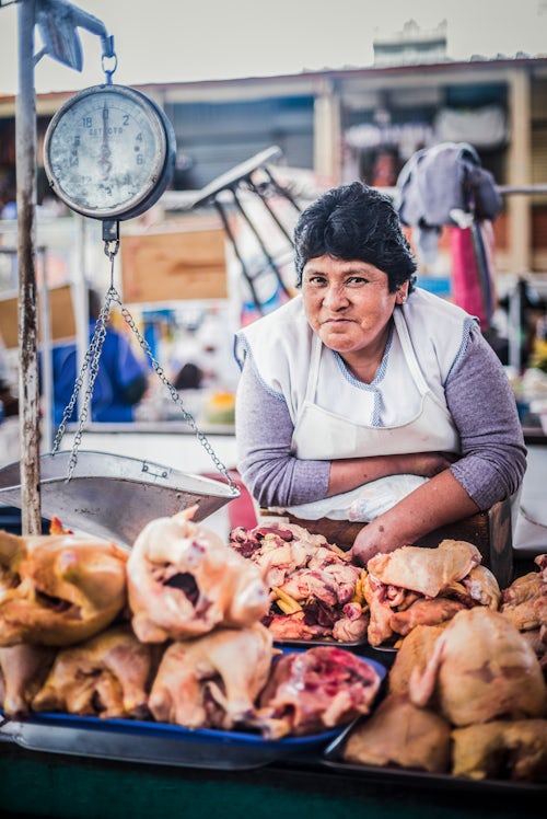 Peru Travel Portrait Photography Documentary Portraiture Portrait of Peruvian woman selling meat at San Camilo Market Mercado San Camilo Arequipa Peru South America