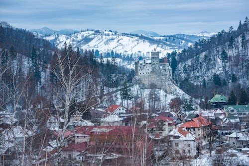 Romania Landscape Travel Photography Bran Castle covered in snow in winter Transylvania Romania 2