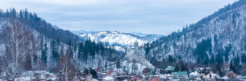 Romania Landscape Travel Photography Bran Castle covered in snow in winter Transylvania Romania 3