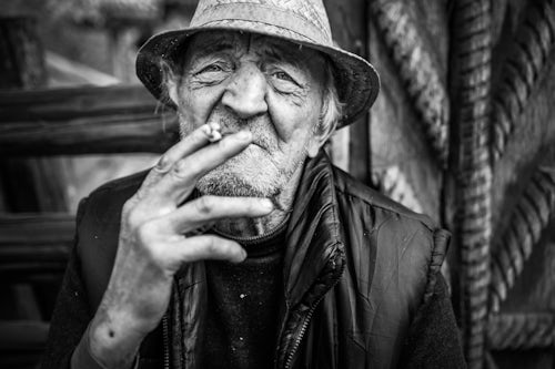 Romania Travel Portrait Photography Documentary Portraiture Portrait of a Romanian man smoking in Sarbi Maramures Romania